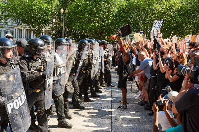 Protestors
      in front of riot police