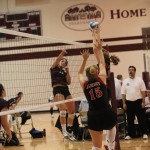 Pezzola (left) launched the Garnet to its fourth Conference victory with 19 kills and 18 digs.