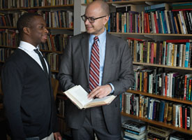 Paul Cato ’14 (left) has benefited immensely from his relationships with Mellon Mays mentors such as Anthony Foy (right), coordinator of the program.