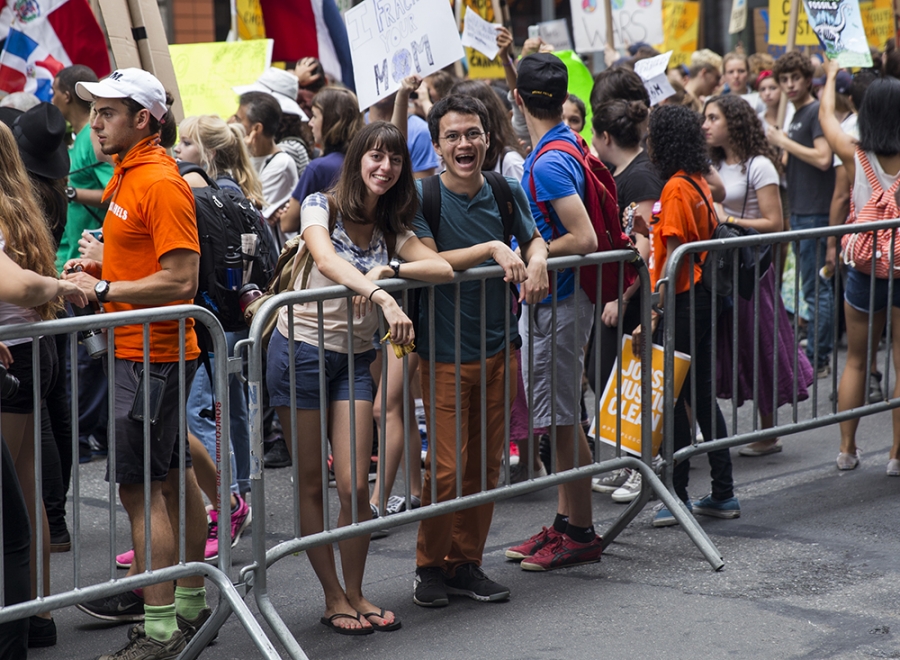 (From left to right) Christine Emery '16 and Thomas Ruan '16 take a small break during the People's Climate March. Photo by Martin Froger-Silva '16.