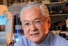 Joseph Takahashi ’74—Public Health Adviser is an older man with glasses and white hair looking at the camera. 