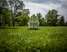 white chair outside on green grass